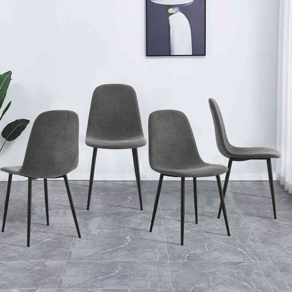 A set of 4 modern medieval style restaurant cushioned side chairs, equipped with soft cushions and black metal legs, suitable for kitchens, lounges, and farmhouses. B0501A